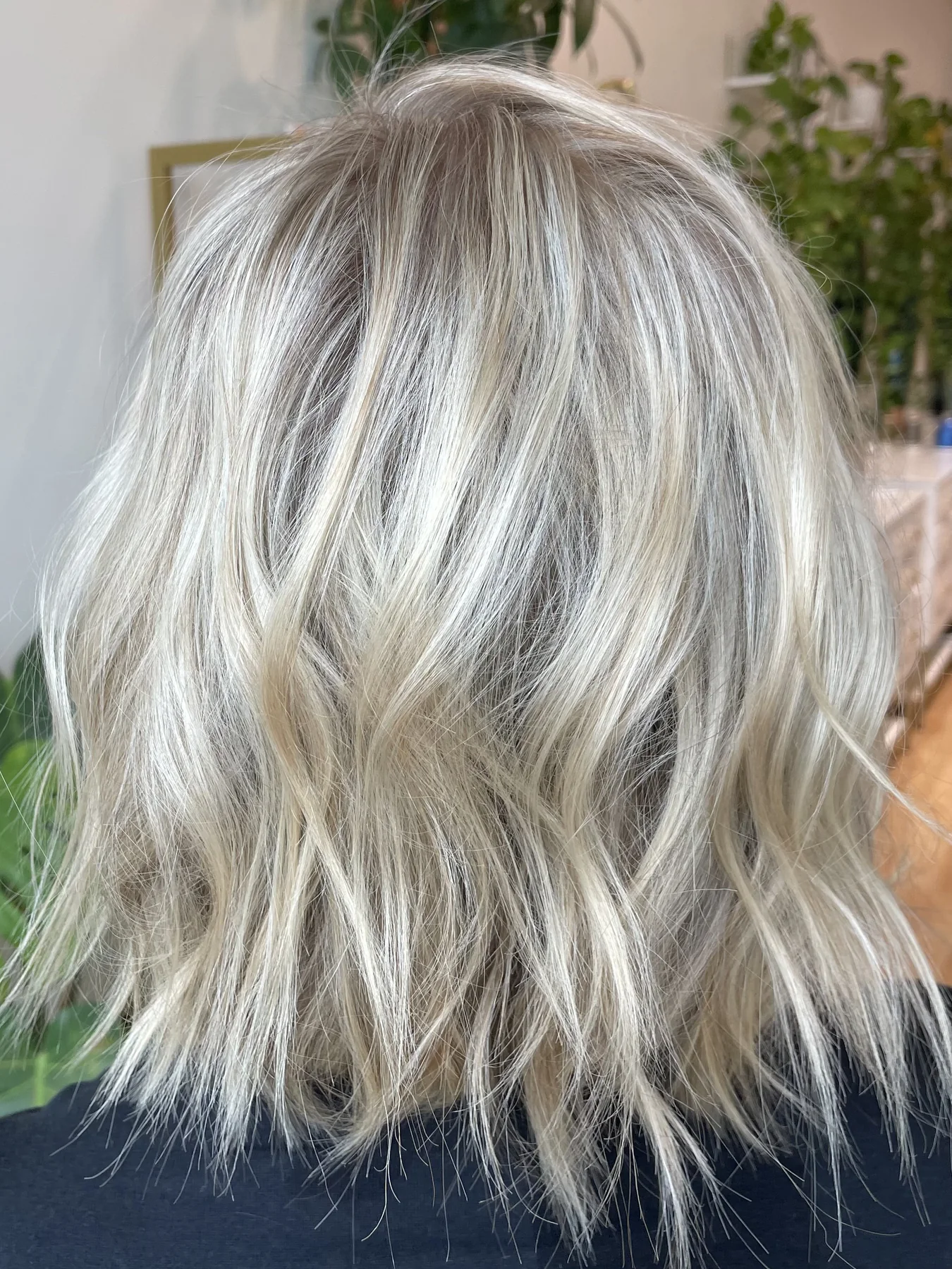 Soft blonde bob with a polished dry haircut shape